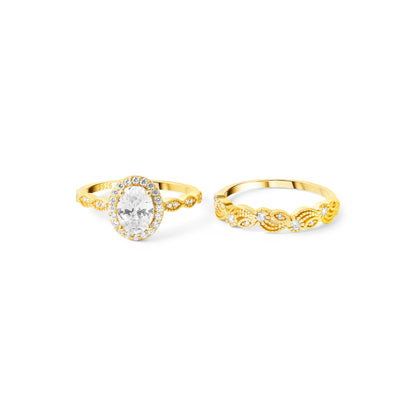 Side view of gold plated oval halo zircon ring with double band design
