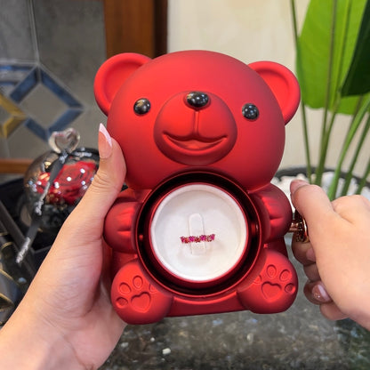 7 hearts of love ring inside hidden compartment of red teddy bear rose box