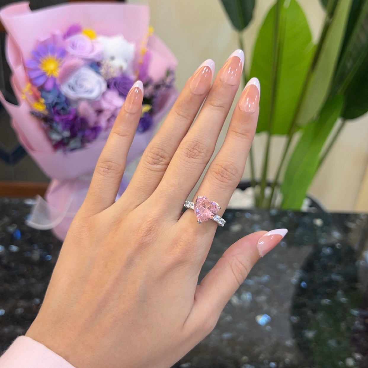 Blush pink heart ring worn on hand, 925 sterling silver