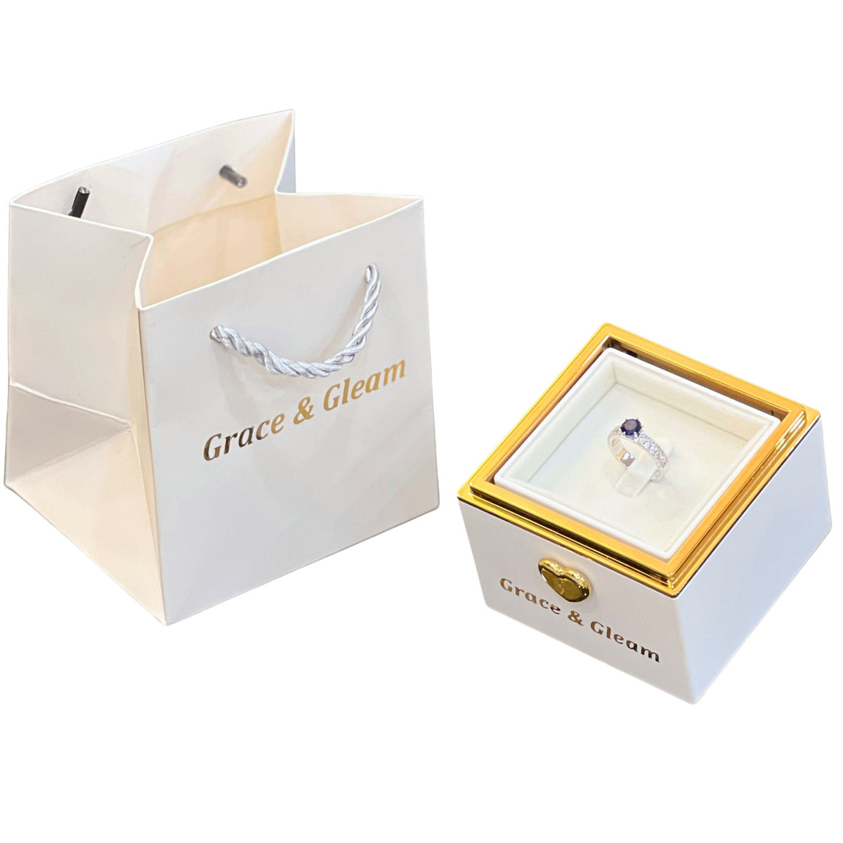 Ocean blue ring in white candle-lit birthday box with white Grace & Gleam gift bag