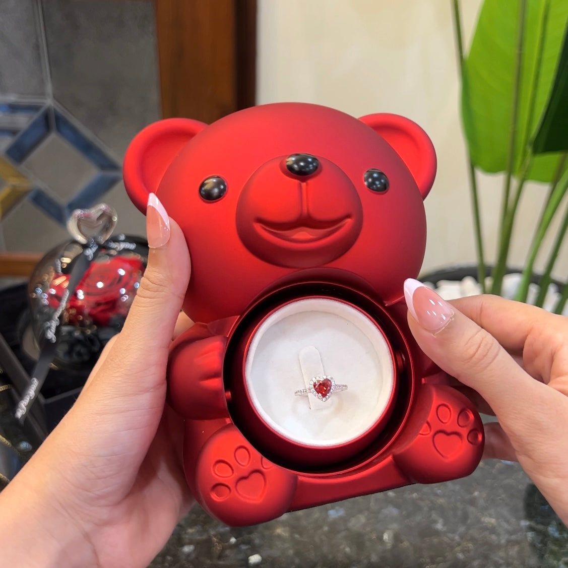 Elite heart ring inside hidden compartment of teddy bear rose box