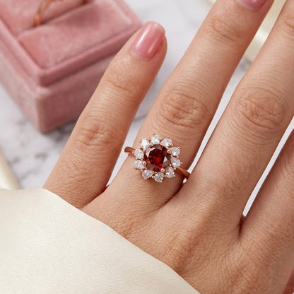 Woman wearing Floral Flame Ring with garnet red zircon flower design