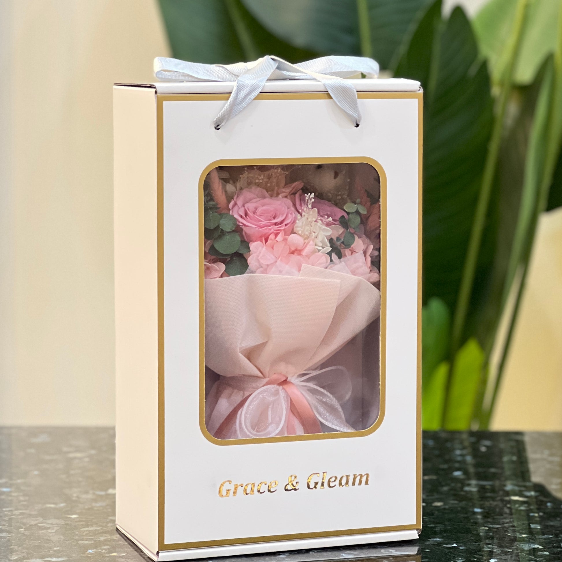 Pink preserved flower bouquet in a Grace & Gleam window gift box