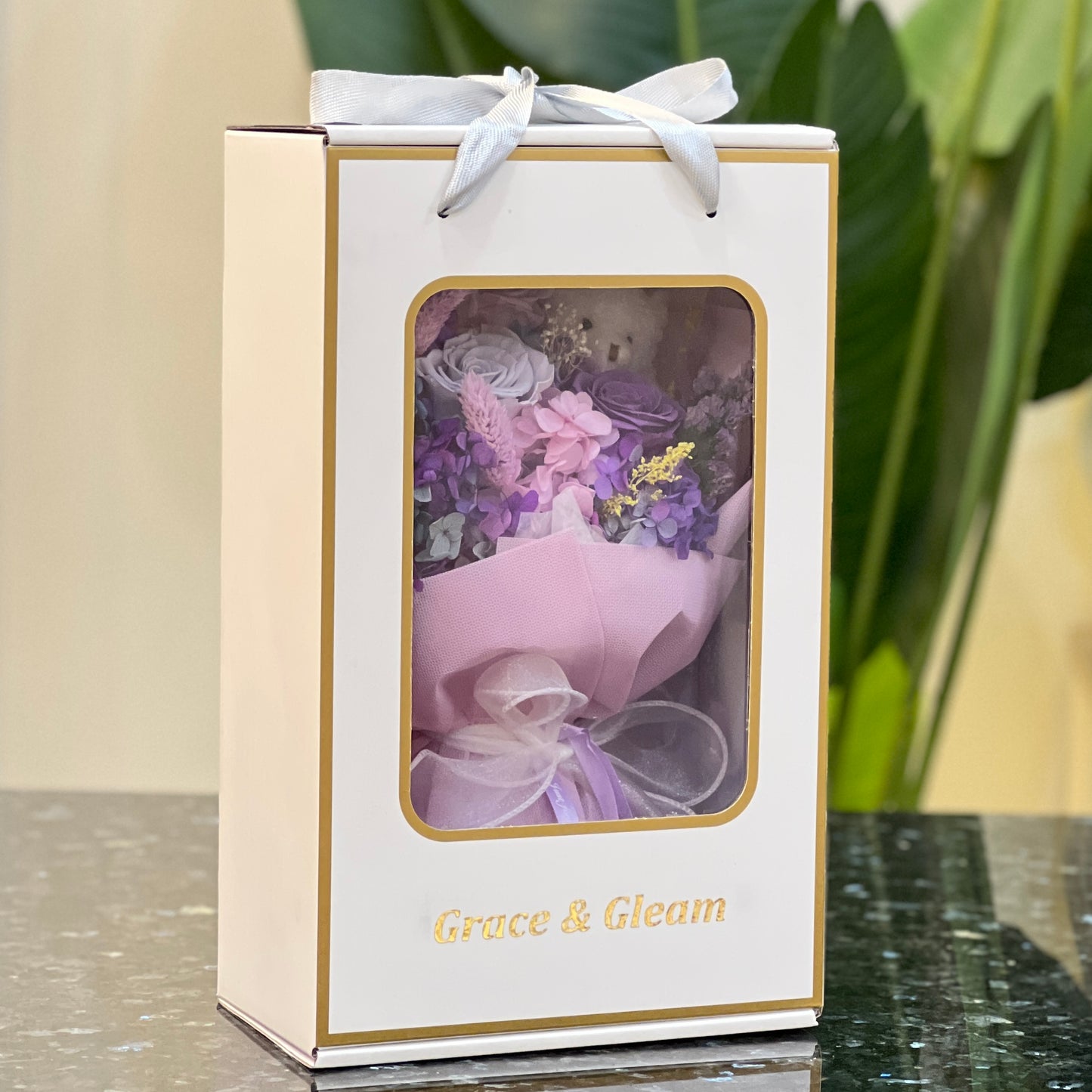 Purple preserved flower bouquet in a Grace & Gleam window gift box