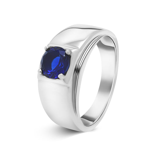 Angled view of The Sapphire men’s silver ring with deep blue zircon – Grace & Gleam