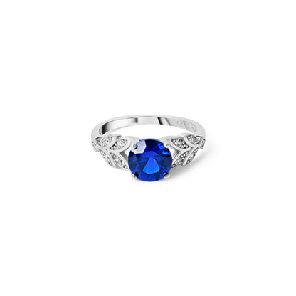 Blue sapphire inspired floral silver ring with zircon petal details