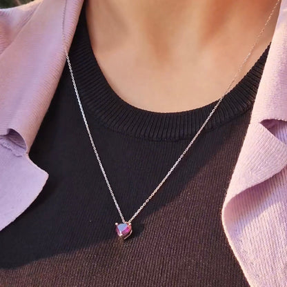 Purple heart pendant worn by model, 925 sterling silver